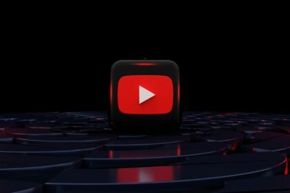 a red play button on a black background