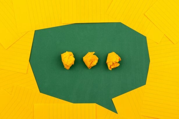 three crumpled yellow papers on green surface surrounded by yellow lined papers